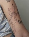 Fairy-Dust-Tattoo-Black-Arm-Ink.jpg