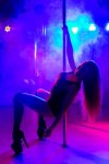 pole-dance-slender-sexy-woman-dancing-interior-nightclub-with-colored-background_199620-7835.jpg