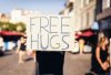 man-holding-free-hugs-sign-260nw-574298731-1.jpg