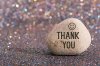 white-stone-words-thank-you-smile-face-color-glitter-boke-background-117350639.jpg
