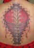 Ripped-Skin-Corset-Tattoo-On-Girl-Upper-Back.jpg