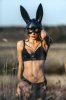 109479752-beautiful-sexy-woman-wearing-black-fashion-rabbit-mask-posing-on-the-autumn-field.jpg