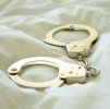 hand-cuffs-on-bed-royalty-free-image-1605546865.jpeg